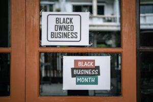 black owned business month sign were attached window