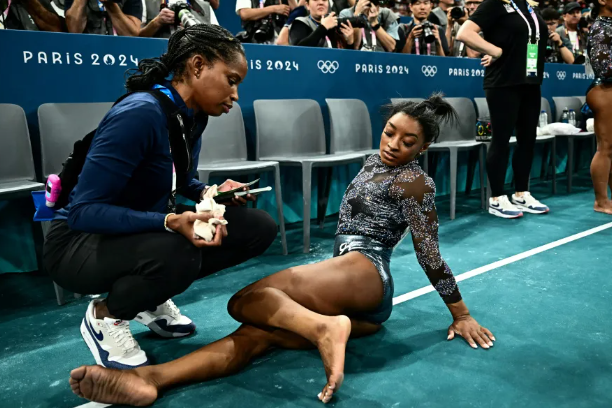 Simone Biles Overcomes Calf Pain to Shine in Qualifiers