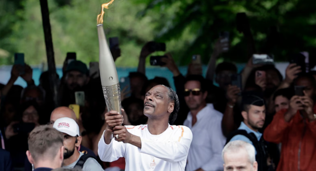 Snoop Dogg Carries Olympic Torch Ahead of Paris Opening Ceremony